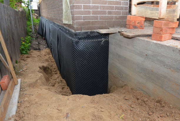 Happy homeowners after waterproofing job in Columbiana